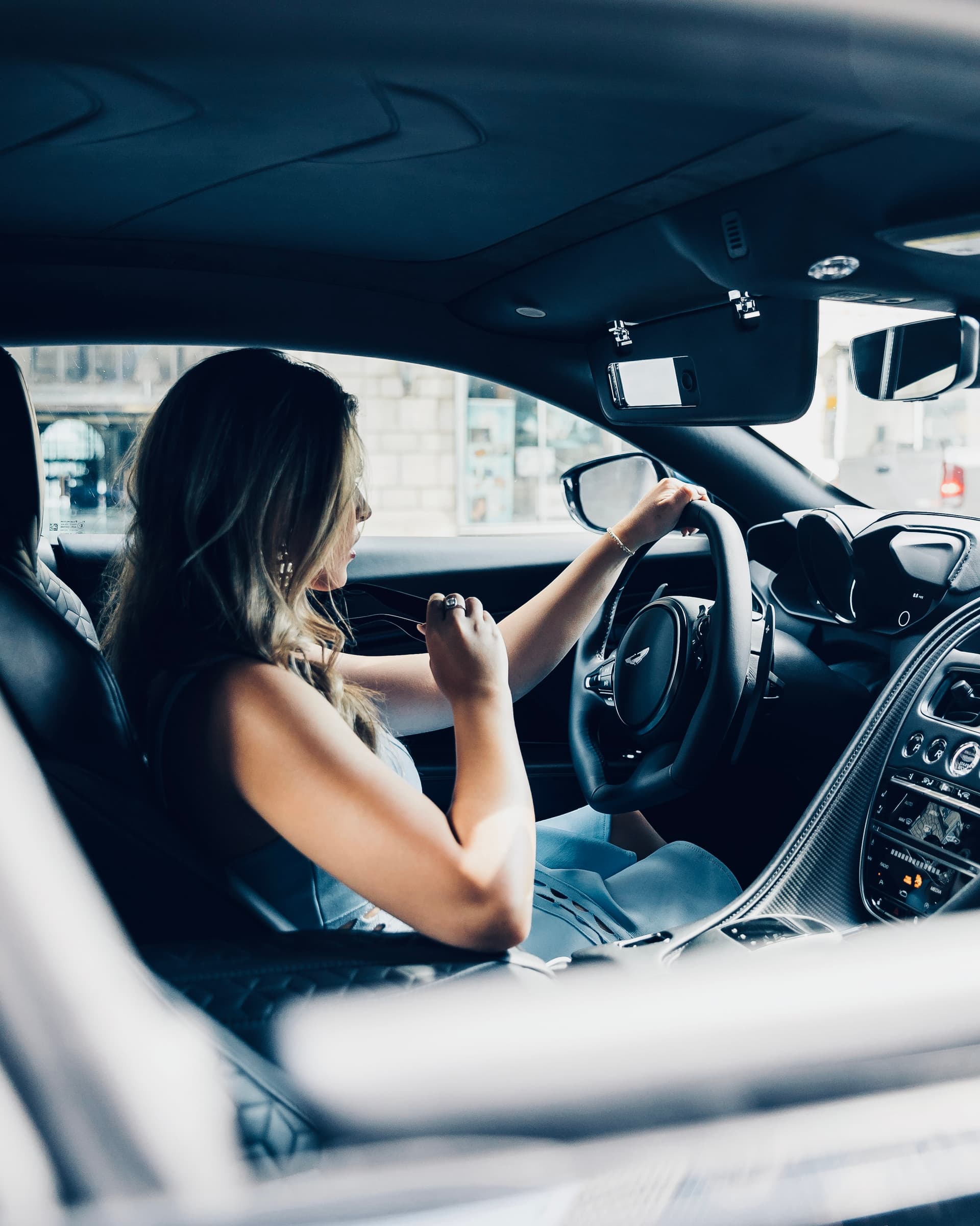 Woman smiling in her car
